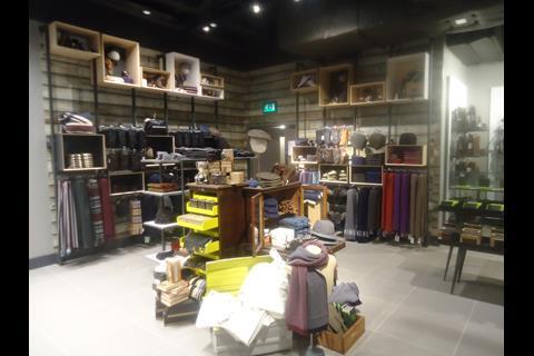 John Lewis has used different-sized wooden boxes to display products in creative ways